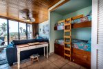 bunk beds, living area, ceiling fan, bay window wall